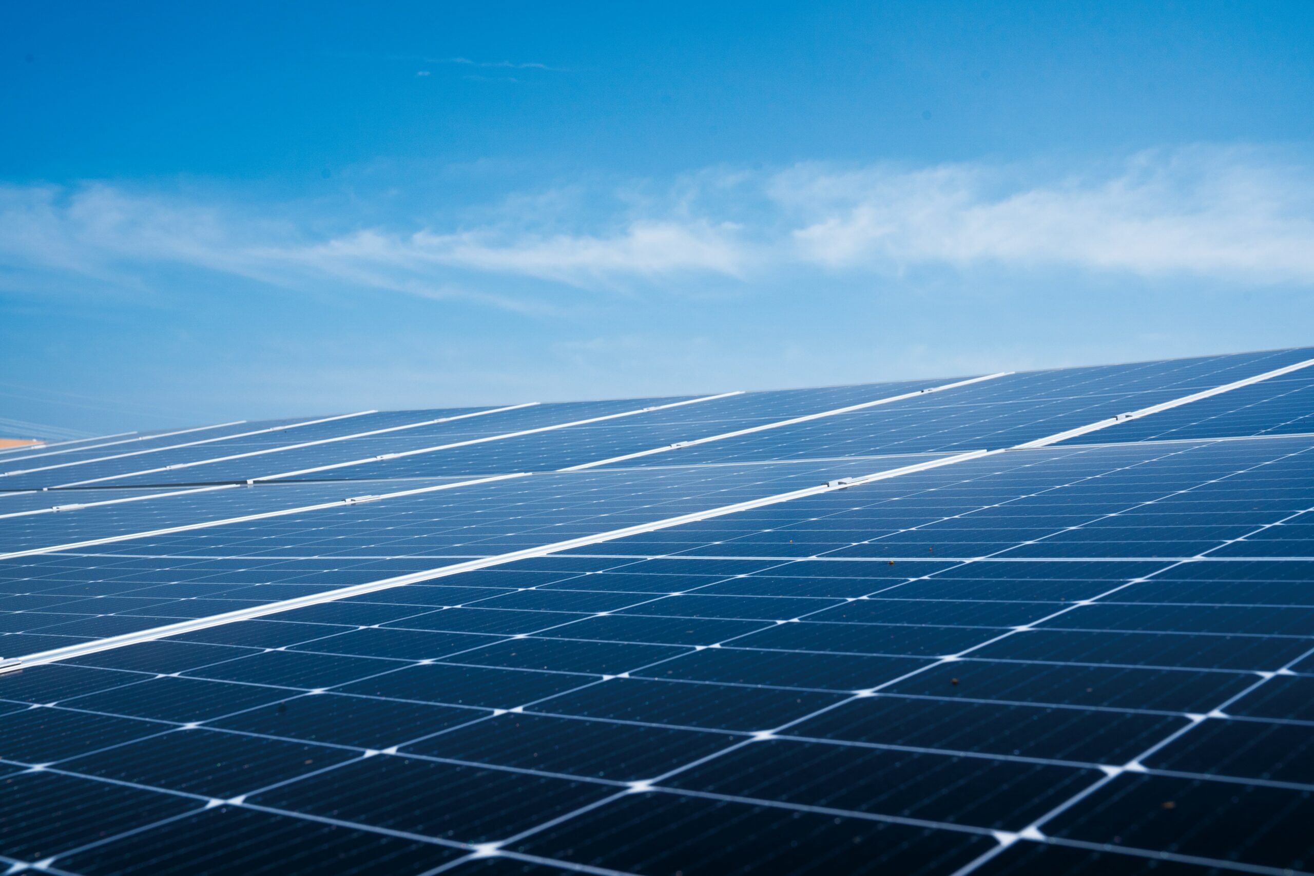 Commercial rooftop solar panels representing corporate ESG reporting and precision energy metering