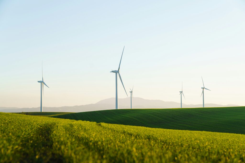 Wind turbines generating renewable energy for corporate Scope 2 emissions reporting